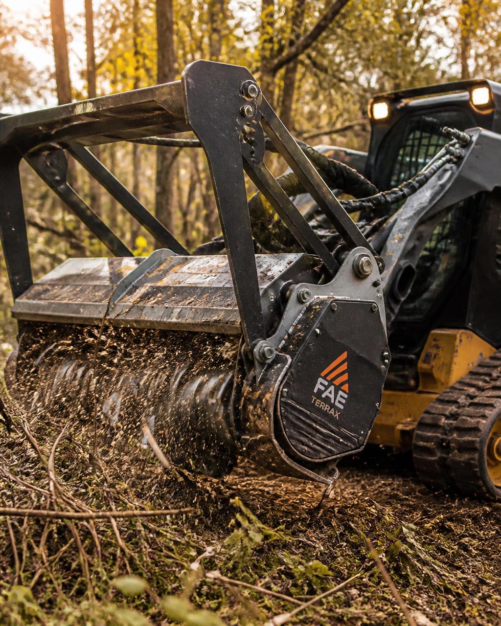 Heavy-duty forestry mulcher head grinding through thick brush in Indiana